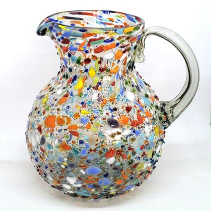 New Items / Confetti Rocks 120 oz Large Bola Pitcher / Confetti rocks appear to rest inside this modern blown glass pitcher that will make your table setting shine. Each pitcher is adorned with hundreds of tiny multicolor glass particles, giving it a one-of-a-kind look and feel.